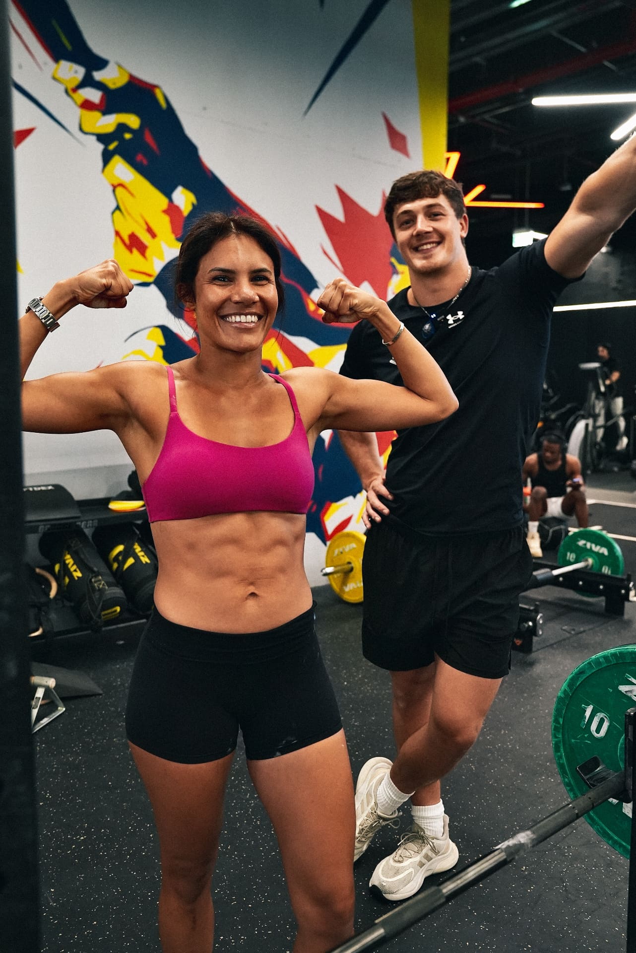 Coach and client celebrating a transformation milestone